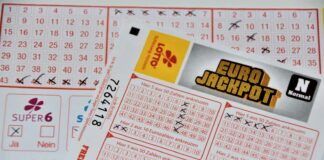 white and red calendar on white wall