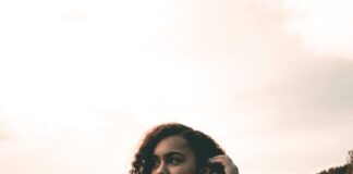 woman standing on grass field at daytime