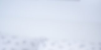 opened book on white textile