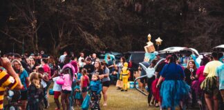 a large group of people standing around each other