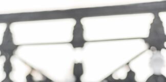 a bottle of chanel on a table next to a bag