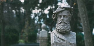 gray concrete statue of woman