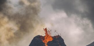 fire coming from mountain during daytime