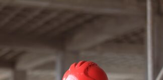 a man wearing a red hard hat and jacket