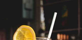 orange juice in clear drinking glass