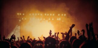 band performing on stage in front of people