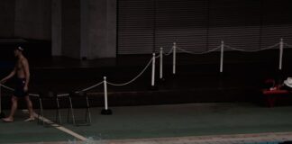 a man flying through the air over a body of water