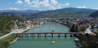 an aerial view of a bridge over a river