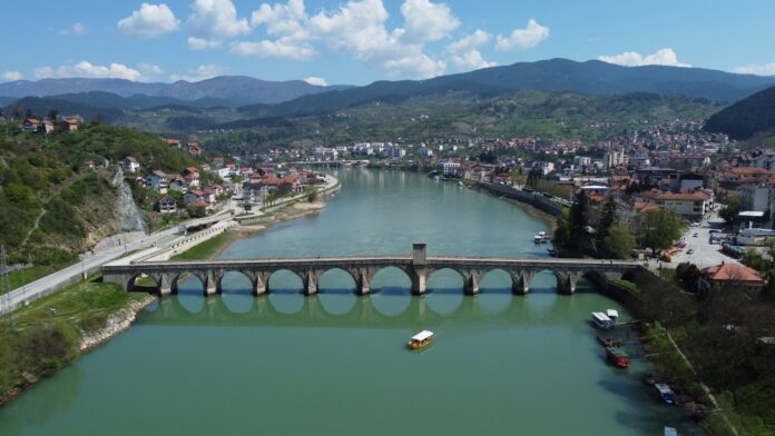 an aerial view of a bridge over a river