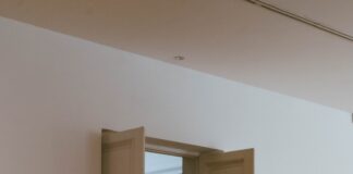 Open doors reveal a glimpse of another room.