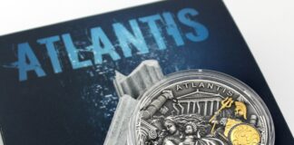 silver and black round coin