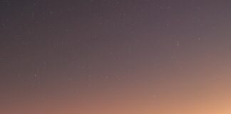 brown sand under blue sky during night time