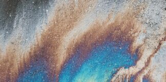 person standing on oil spilled surface