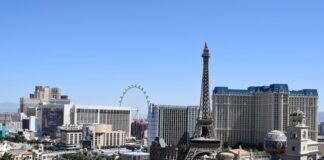 white and gray concrete building near body of water during daytime