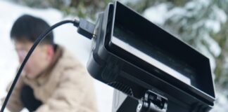 a video camera sitting on top of a tripod