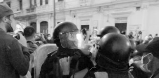 grayscale photo of man in black helmet
