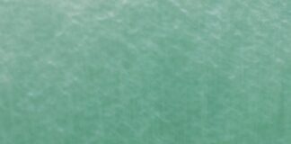 a person in a kayak in the middle of a body of water