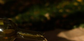 clear wine glass with brown liquid
