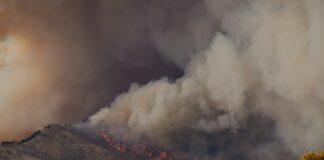 white smoke coming from a gray clouds