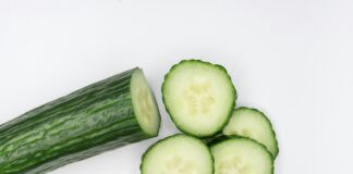 sliced cucumber on white surface