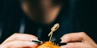 person holding burger