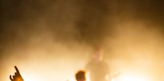 people watching band on the stage