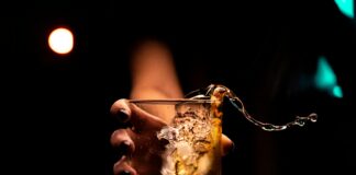 clear drinking glass with ice cubes
