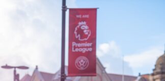 a crowd of people with colored powder in the air