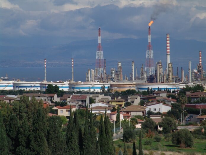 green trees near city buildings during daytime
