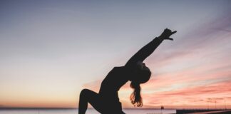silhouette photography of woman doing yoga