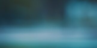 a tennis ball sitting on top of a tennis court