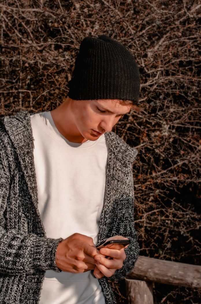 woman in black knit cap and white crew neck shirt
