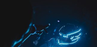 a futuristic vehicle with a blue light around it