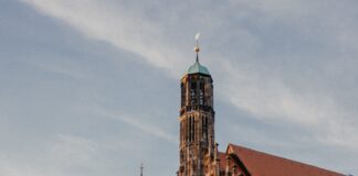 a large brick building with a tall tower