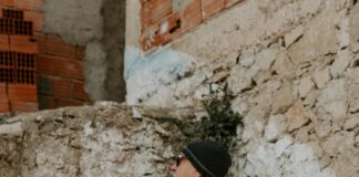 a man standing on steps with a cane in his hand
