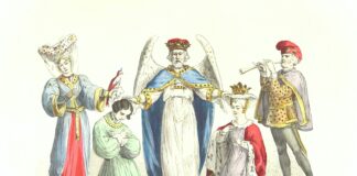 man in blue and white dress holding gold and red trophy