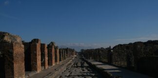 a stone wall with a stone walkway