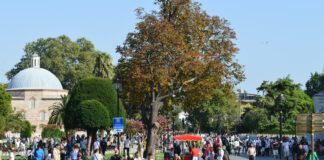 a group of people walking on a street