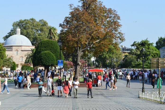 a group of people walking on a street