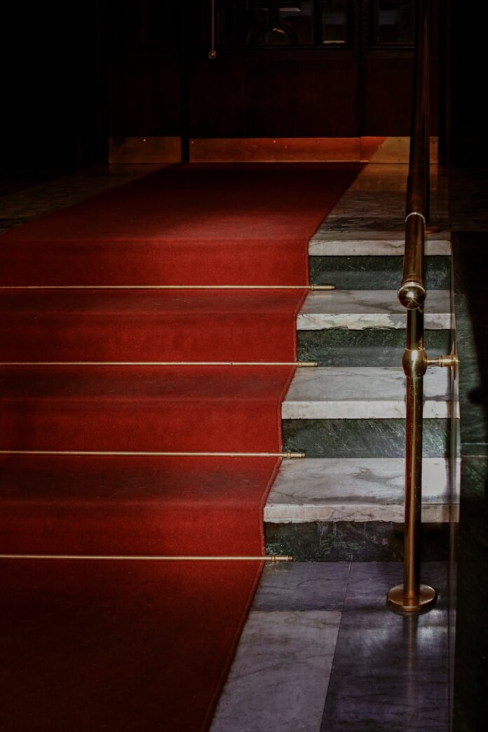 red concrete staircase with stainless steel railings