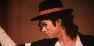 a man in a top hat and black jacket