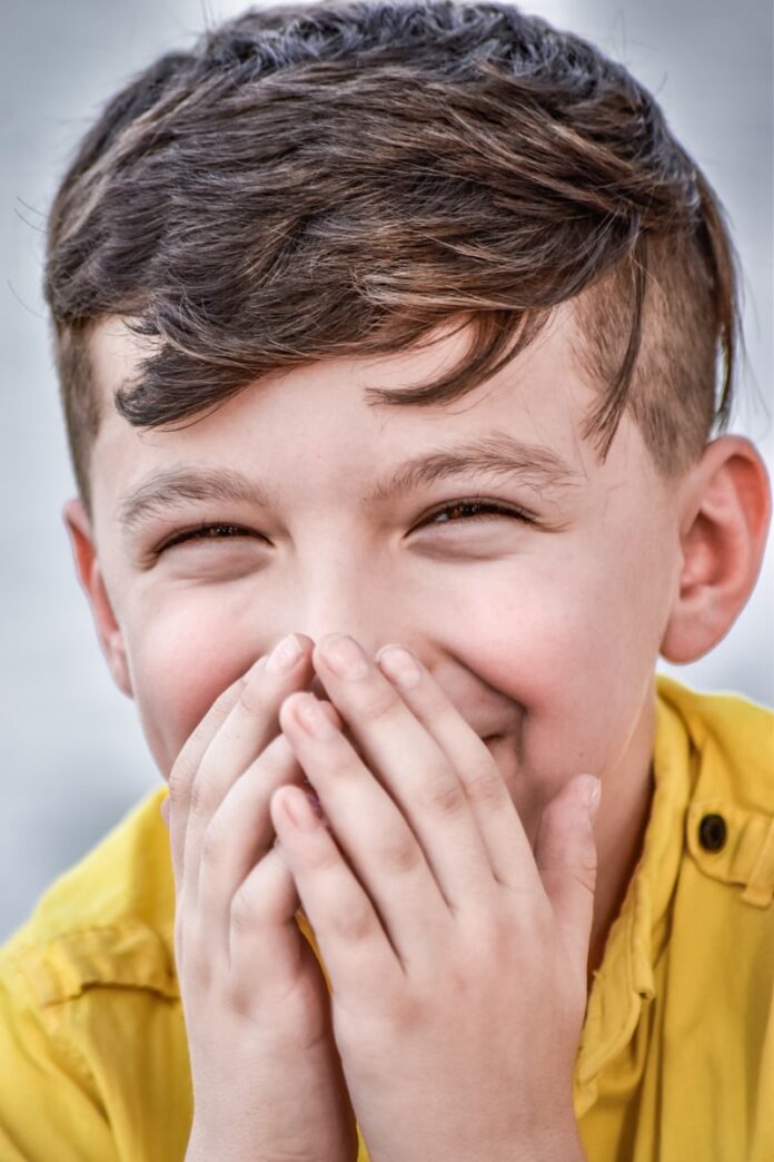 a person covering the face with the hands