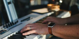 a close up of a person playing a keyboard