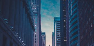 vehicles near buildings at night time