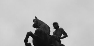 Equestrian statue against a cloudy sky