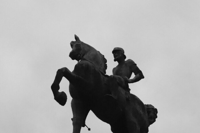 Equestrian statue against a cloudy sky