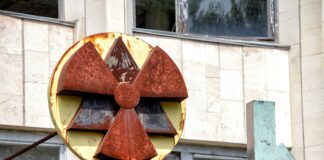 red and yellow radioactive signage at the building