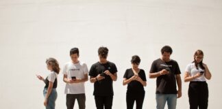 group of people standing on brown floor
