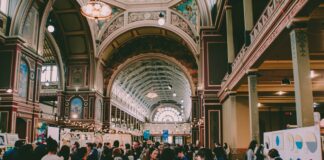 people walking in hallway