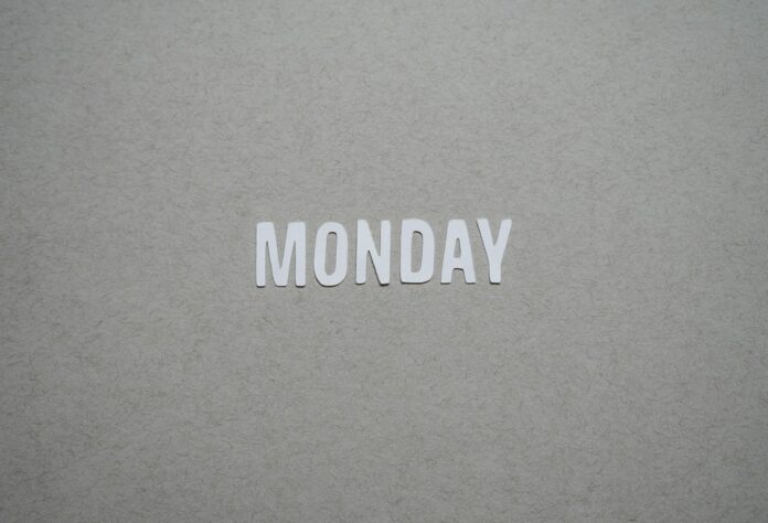 the word monday is cut out of white paper